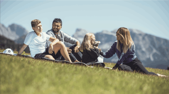 Family laying on the grass