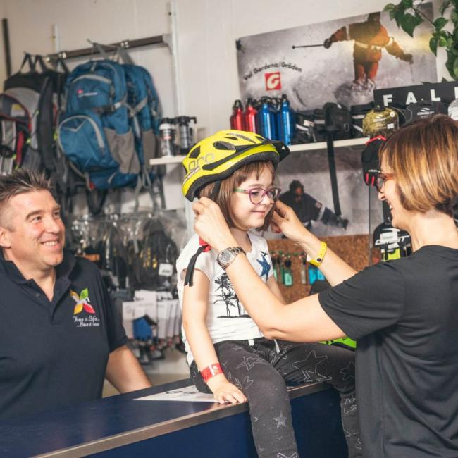 Little girl wearing bicycle helmet