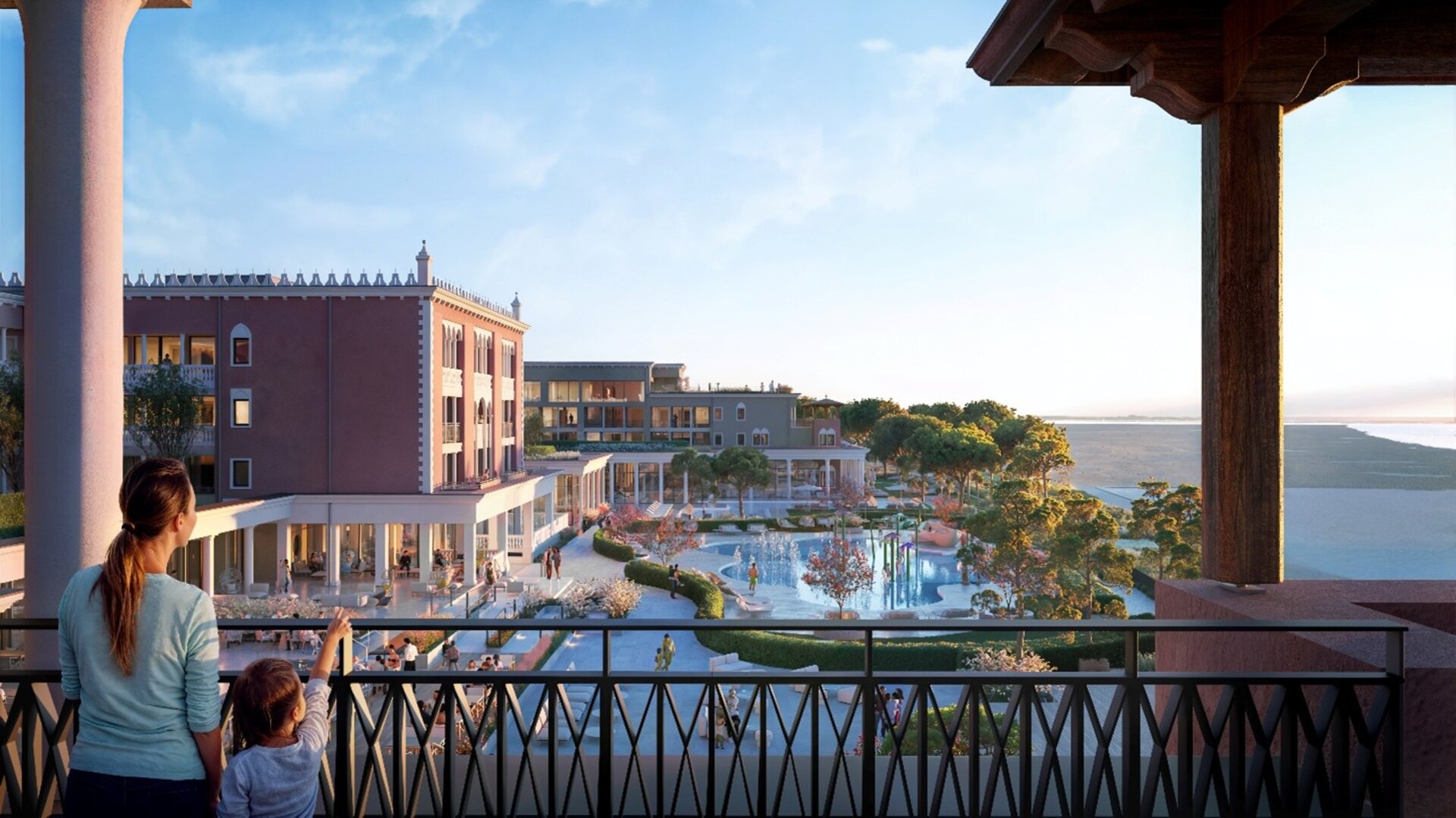 Madre e bambino guardano gli esterni del family hotel 5 stelle al mare.