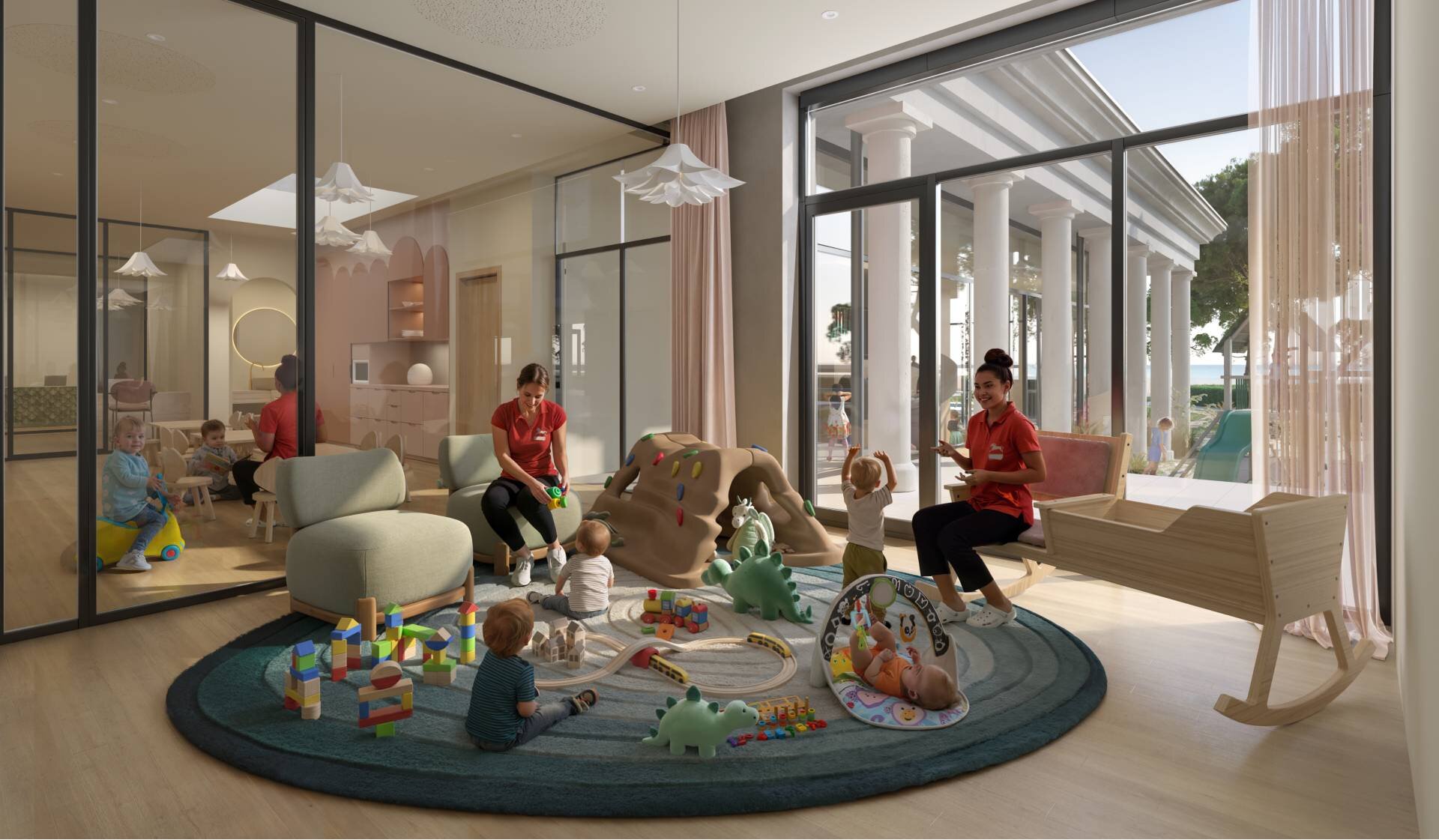 Bambini e animatrici interagiscono nel family hotel in veneto sul mare.