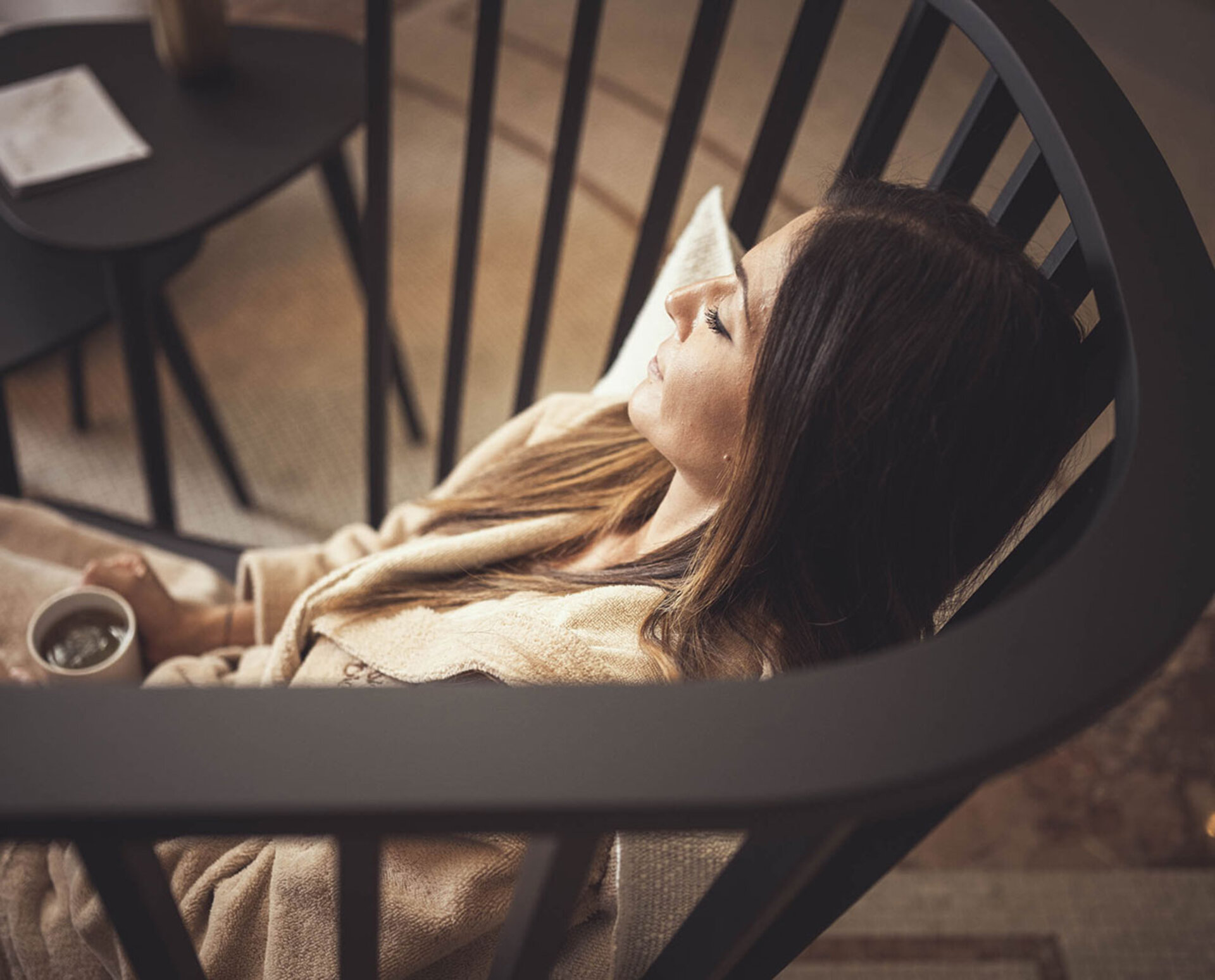 Woman relaxing in the relaxation area of ​​the hotel spa.